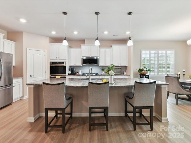 Large Center Island with Pendants. Upgraded Granite Counters | Image 11