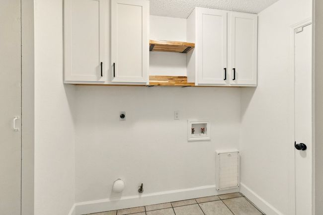 Large in-home laundry room allows for laundry, storage and functional pet door if you choose to use it. | Image 9