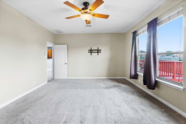 Unfurnished room with carpet floors and a ceiling fan | Image 21