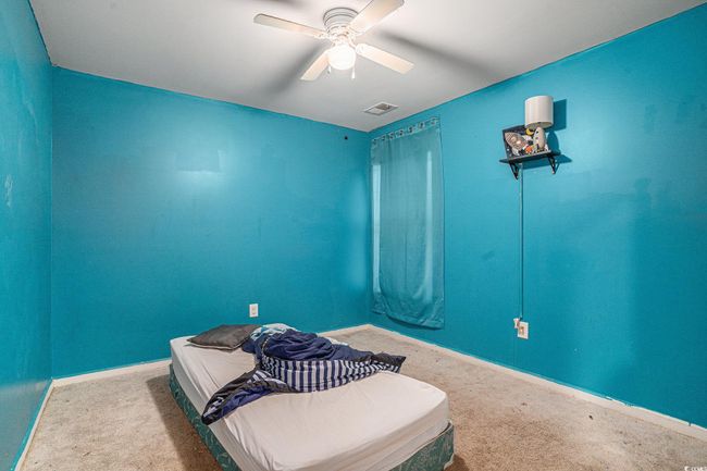 Bedroom featuring carpet floors, baseboards, and a ceiling fan | Image 18