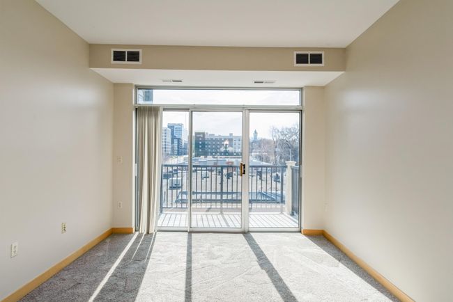 There is plenty of room for a comfy couch and sitting area. (The photos are of unit 401. Owned by the same person and finishes that are VERY similar) | Image 8