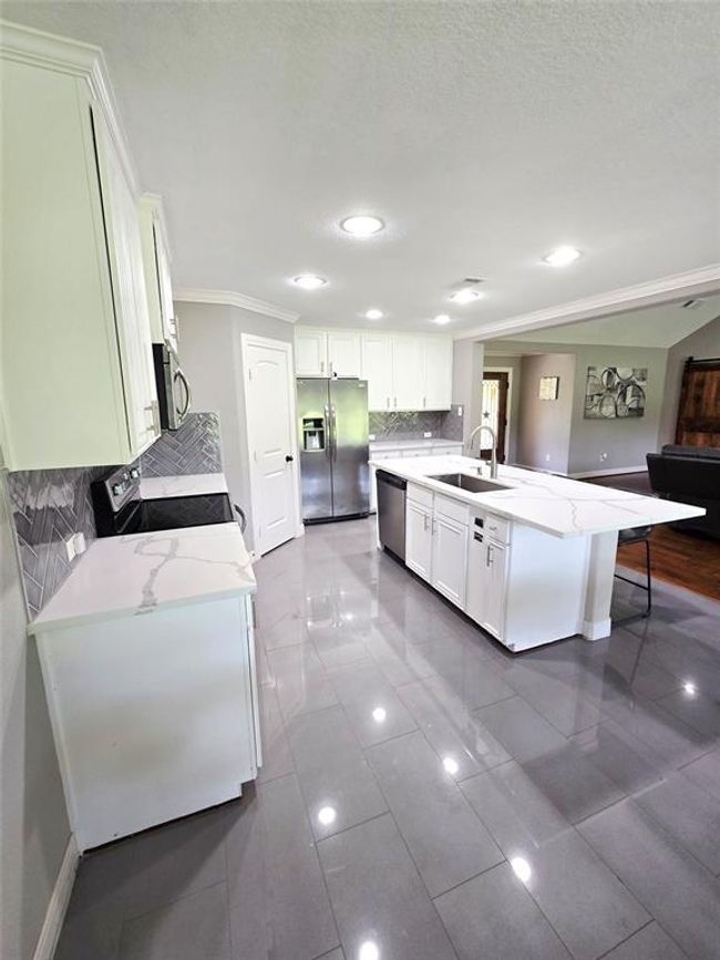 More views of the spacious kitchen. | Image 11