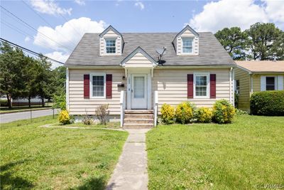 New england style home with a front yard | Image 2