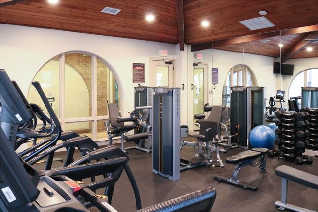 Gym with wooden ceiling, visible vents, high vaulted ceiling, and recessed lighting | Image 33