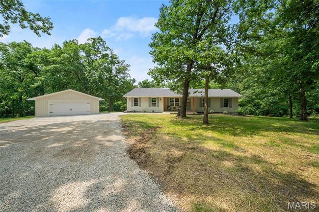 Single story home with an outbuilding, a garage, and a front lawn | Image 4