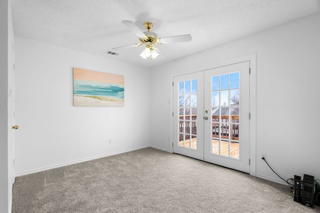 Upstairs is a open loft area with a balcony. | Image 21