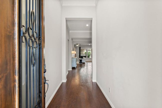 Welcoming entryway with tall ceilings that is warm and spacious | Image 5