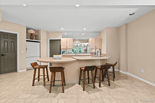 Full kitchen with counter seating in lower level. | Image 36