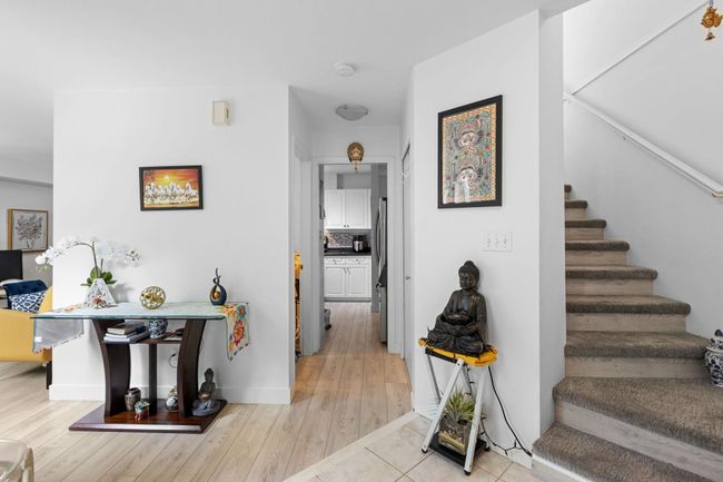 Staircase featuring wood finished floors and baseboards | Image 16