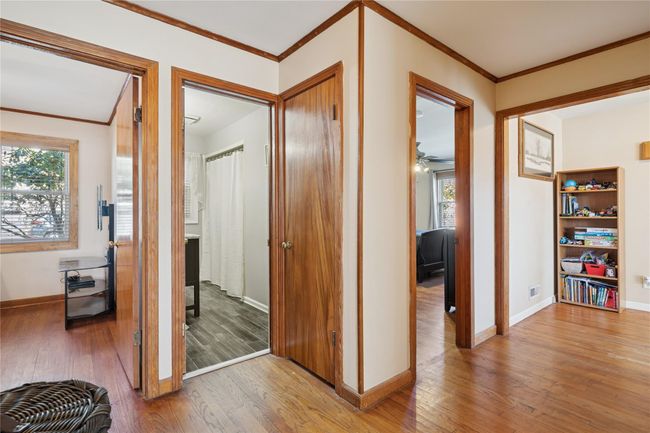 Hallway with ornamental molding and hardwood / wood-style flooring | Image 28