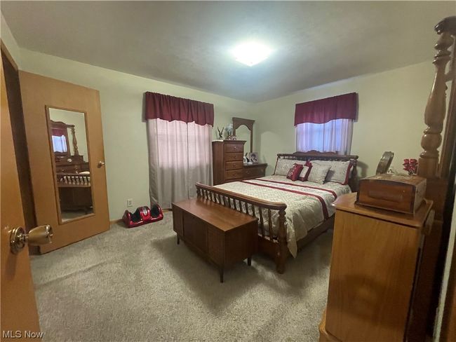 Bedroom featuring carpet floors and multiple windows | Image 25