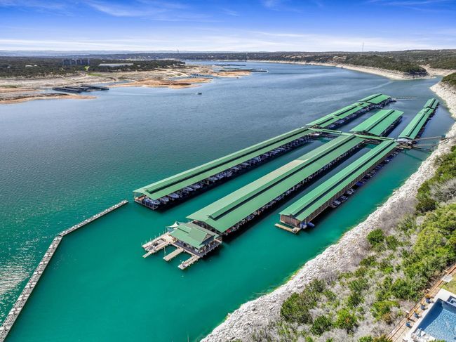 Nestled inside the prestigious gated community of The Hollows, Northshore Marina is a publicly open marina providing 328 fully-equipped high-roof covered wet slips and over 100 personal watercraft ports with an onsite general manager. | Image 45