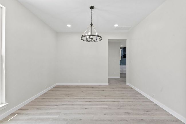 Formal dining with new paint, lights and flooring. | Image 15