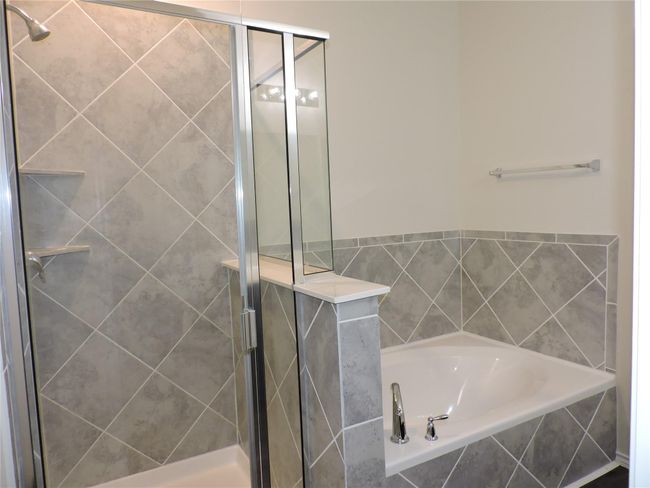 Walk in Shower and Soaking Tub with Ceramic Tile surrounds | Image 21
