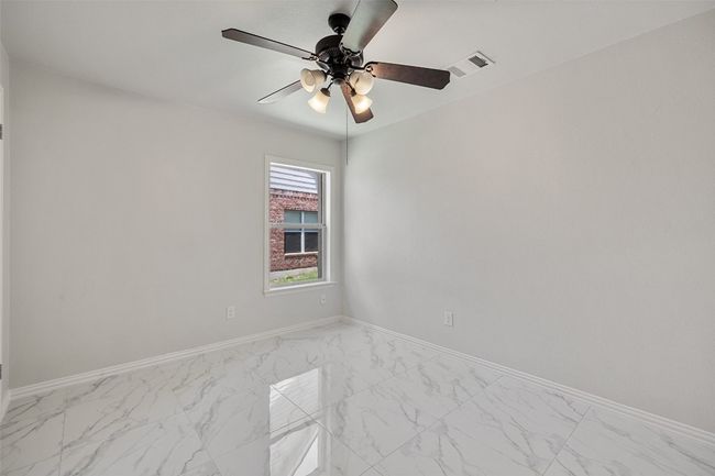 Secondary bedroom with closet. | Image 28