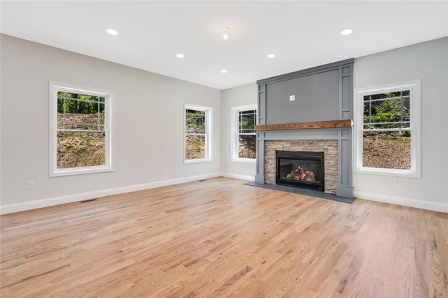 Empty room featuring visible vents, crown molding, and light wood-style floors | Image 16