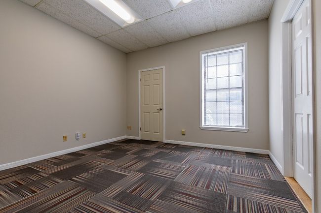 Unfurnished room with carpet and a drop ceiling | Image 8