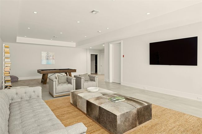Living room with recessed lighting, a raised ceiling, baseboards, and light tile patterned flooring | Image 23