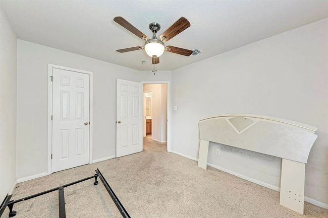 Unfurnished bedroom featuring carpet and ceiling fan | Image 9