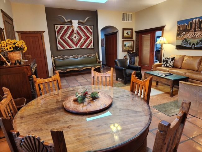 Tiled dining space with arched walkways and visible vents | Image 11