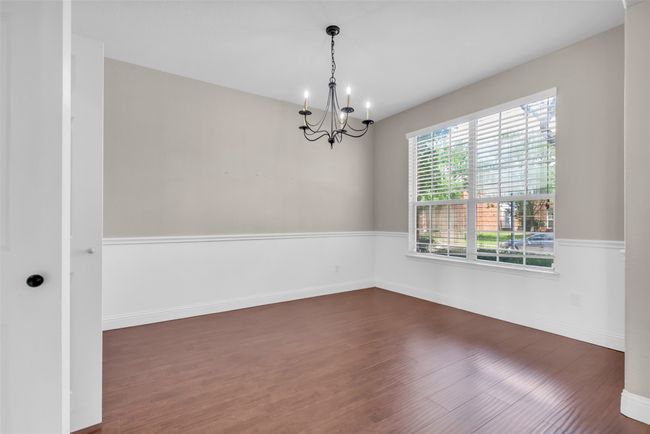 Dining area featuring a chandelier. | Image 5