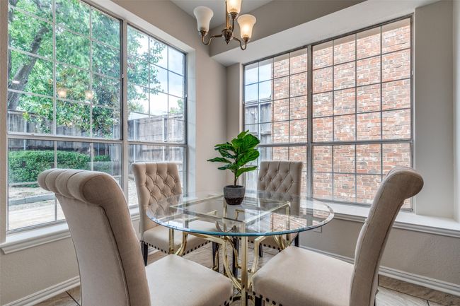 Dining room with baseboards and a chandelier | Image 9