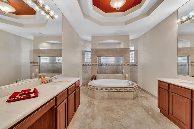 ensuite with soaking tub, double showers, sinks | Image 25