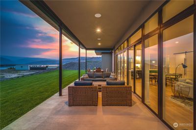 The home design embraces the outdoor lifestyle with an expansive L-shaped patio made for taking in the sun. | Image 2