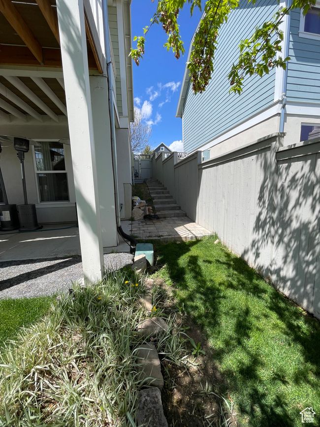 View of side yard featuring fence and a patio area | Image 69