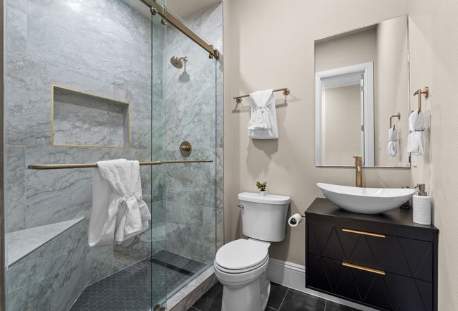Full bath with tile patterned floors, tiled shower, and vanity | Image 29