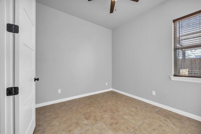 Tiled empty room with ceiling fan | Image 23