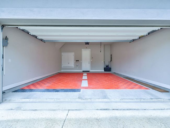 View inside 2 car garage with EV charger | Image 38