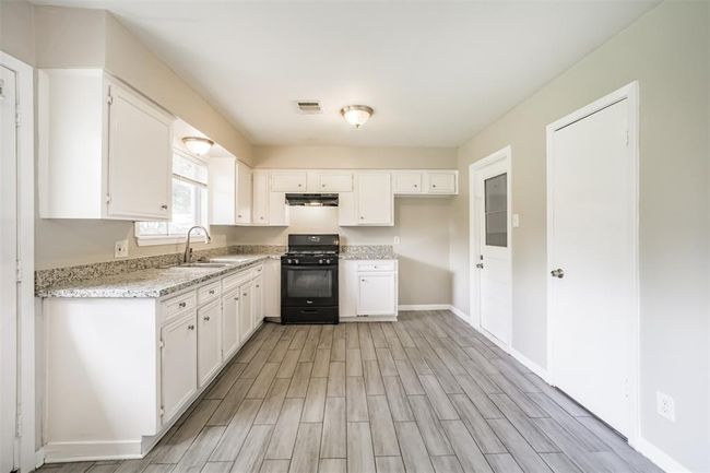Check out this kitchen! So much room to cook with family! | Image 12