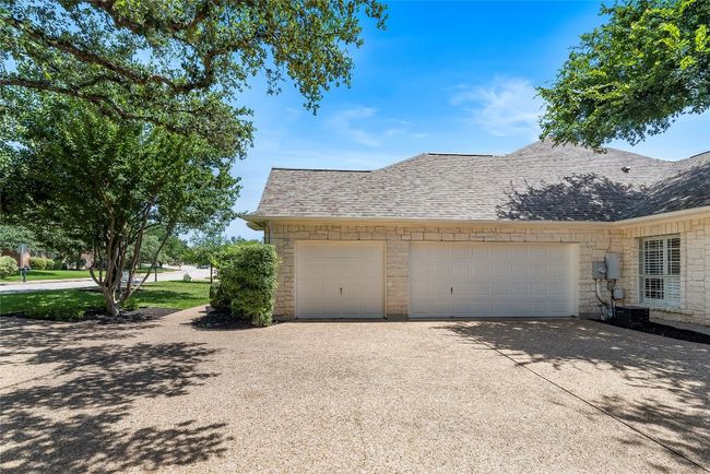 The side-entry three-car garage offers ample space for your vehicles and additional storage | Image 34