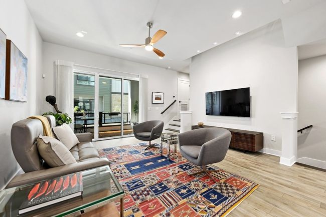 Living room opens to covered patio. | Image 10