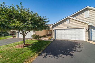 This two bedroom, two bathroom townhome features all living facilities on one level, and is inviting, comfortable, and offers a maintenance-free exterior for easy living! | Image 1