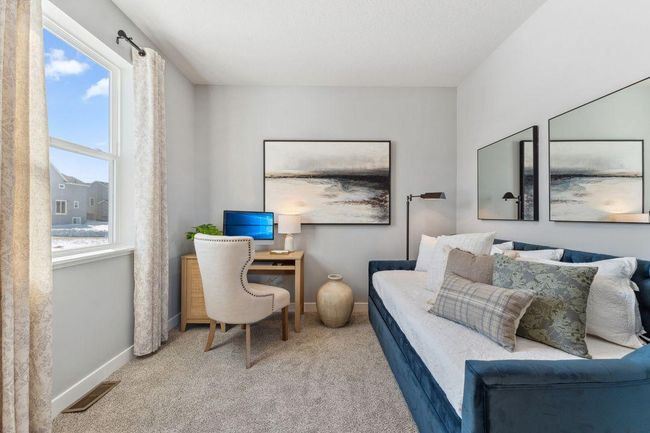 The 5th bedroom is located on the main floor and apart from the living area. Photo of model home, colors and finishes will vary. | Image 17