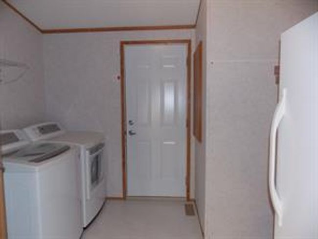 77 - 5210 65 Ave, Home with 3 bedrooms, 2 bathrooms and 3 parking in Olds AB | Image 17