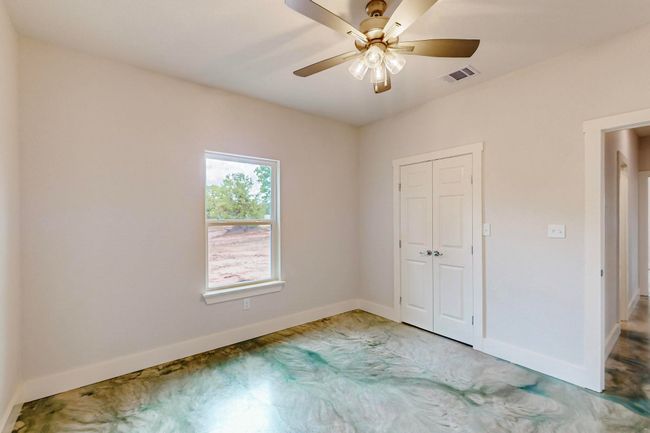 Unfurnished bedroom featuring a closet and ceiling fan | Image 35