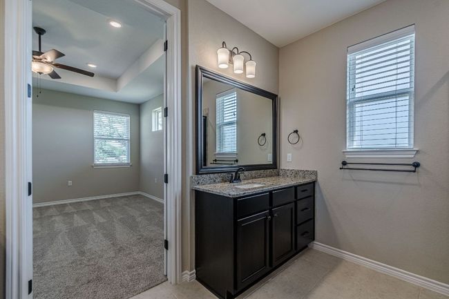 Bathroom with vanity, ceiling fan, recessed lighting, and tile patterned floors | Image 27