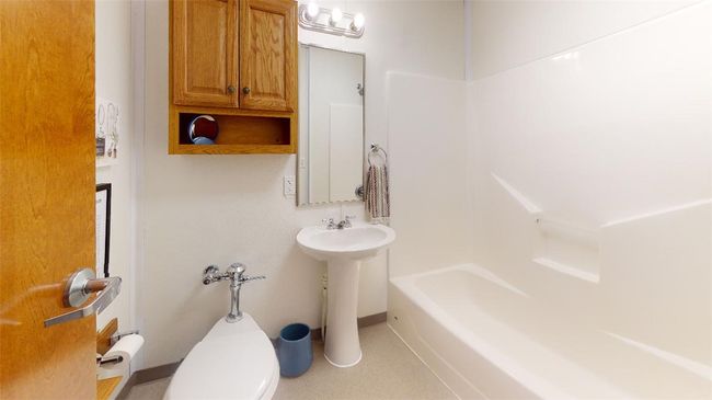 Full bathroom featuring toilet, a sink, and bathtub / shower combination | Image 36
