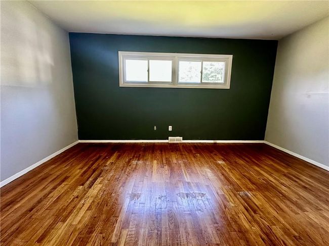 Unfurnished room featuring hardwood / wood-style floors | Image 15