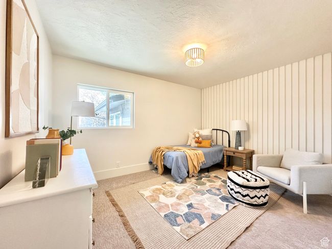 Carpeted bedroom with baseboards and a textured ceiling | Image 23