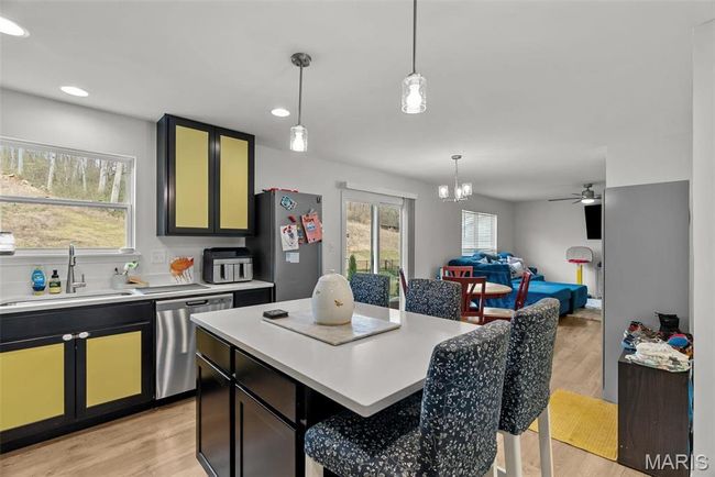 Kitchen with range, dishwasher, and light countertops | Image 31