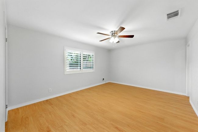 Primary bedroom - check out the plantation shutters that are throughout the home | Image 25