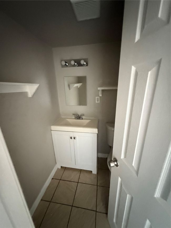 Bathroom with toilet and a bath | Image 5