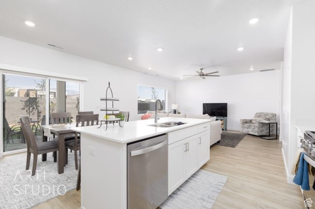 Kitchen with appliances with stainless steel finishes, a healthy amount of sunlight, recessed lighting, and a sink | Image 17