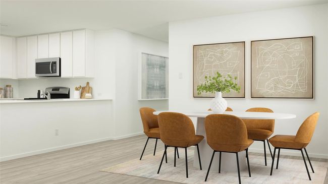 Dining area with light wood-style floors and baseboards | Image 11