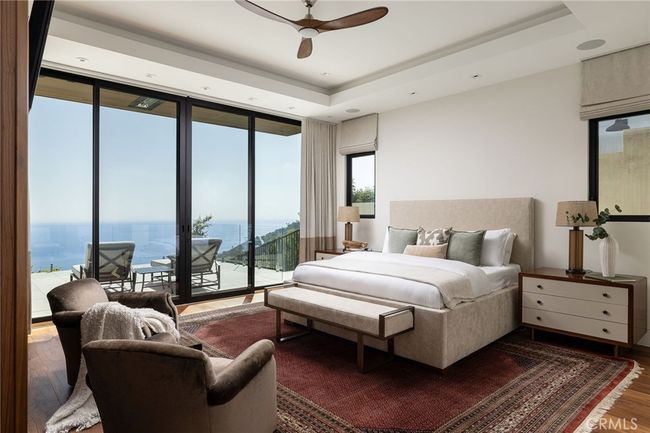 The primary suite is a retreat unto itself, with equally impressive views through your private sliding doors. | Image 13