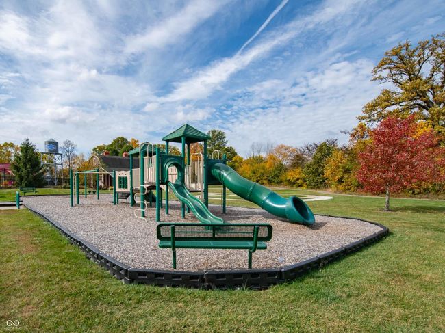 communal playground featuring a lawn | Image 14